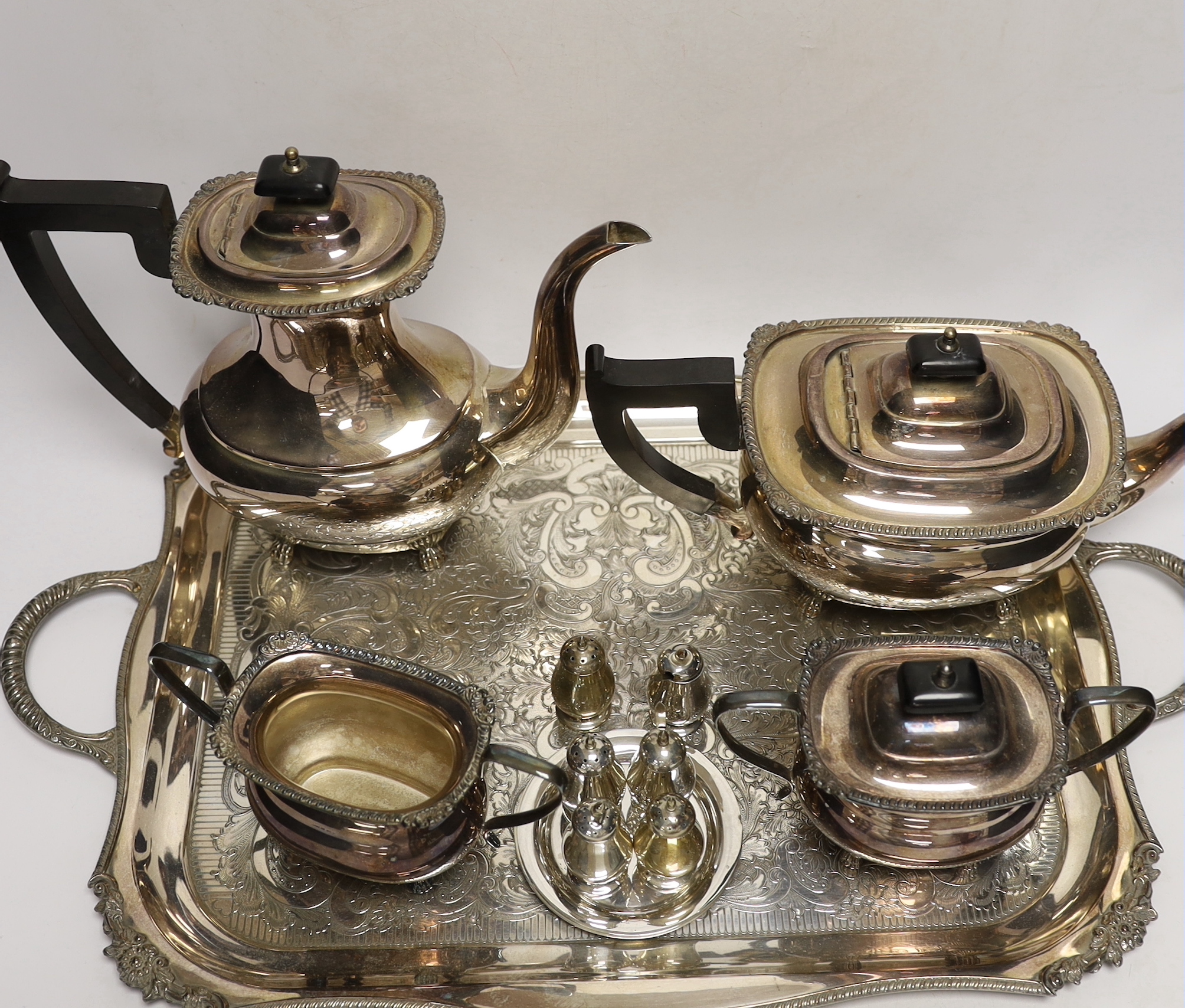 A plated tea / coffee set with ebonised handles and two Sterling condiment sets